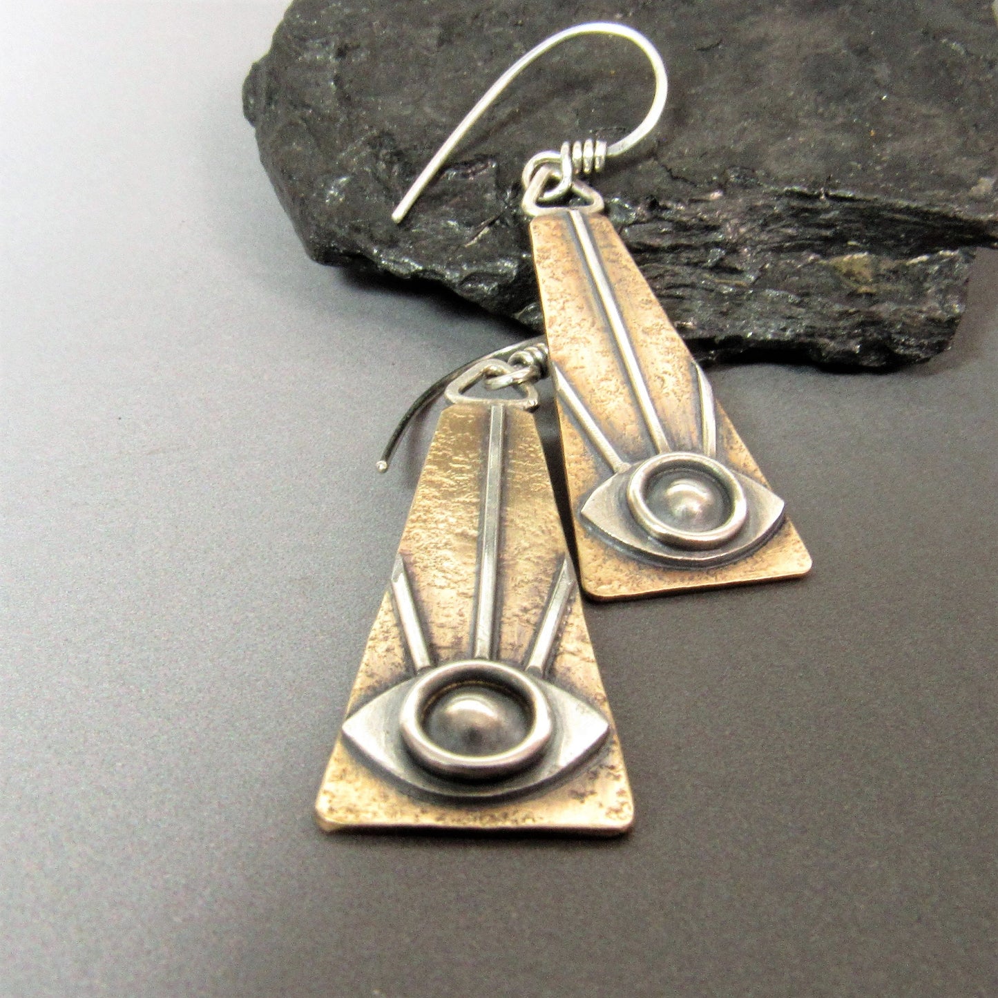 Bronze and Argentium silver all-seeing eye earrings with Art Deco design and oxidized finish