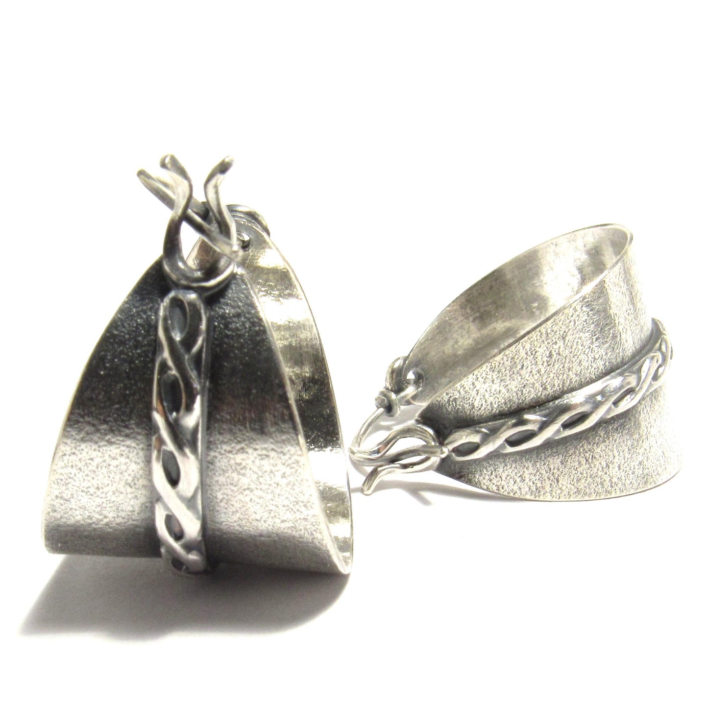 Basket style silver hoops with clasp on white background.