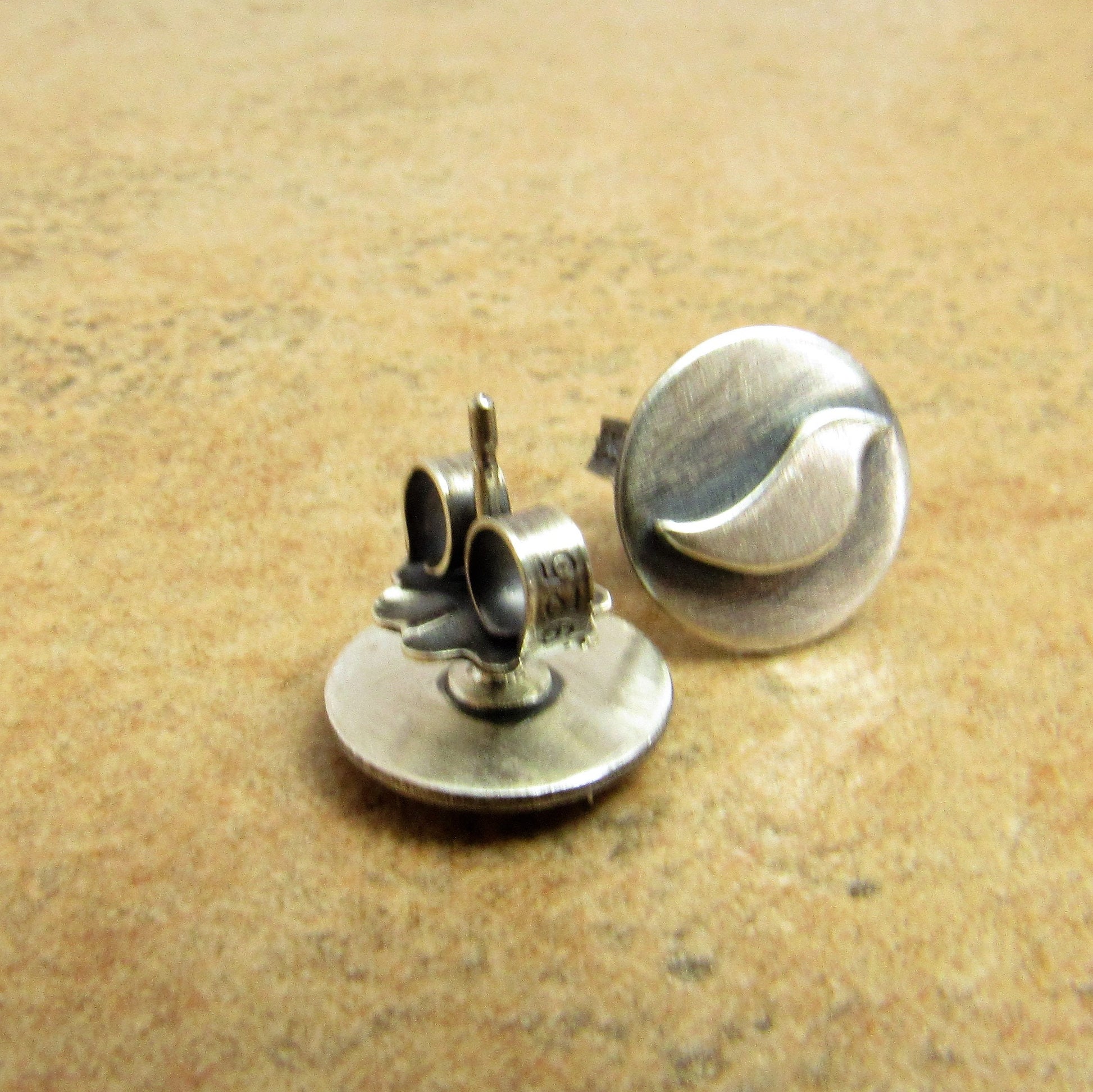 Minimalist bird earrings in oxidized Argentium sterling silver with secure silver clutches.