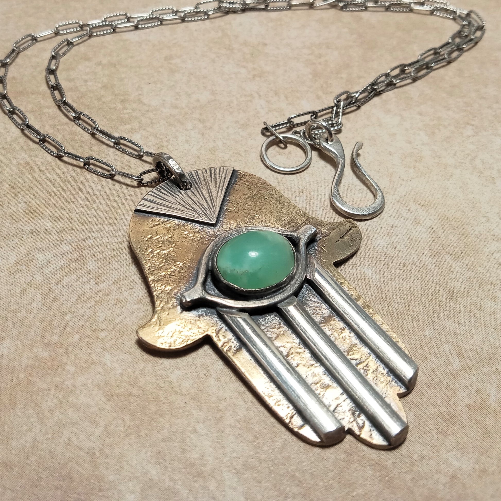 Pendant shown with sterling silver chain and handmade findings, demonstrating craftsmanship and scale.