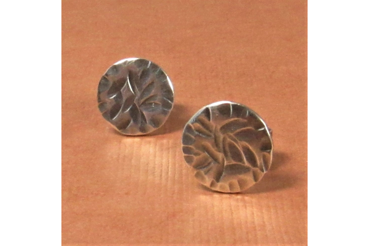 Casual but elegant argentium stud earrings in a disk shape with a rustic texture