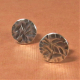 Casual but elegant argentium stud earrings in a disk shape with a rustic texture