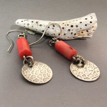 A summery pair of peachy coral earrings with a disc dangle of textured sterling
