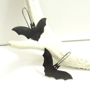  Bat earrings in mixed metal. Displayed on white antler and background.