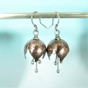 Soulful handcrafted bell flower earrings.  in hammered copper with sterling silver stamens. Magical, musical tinkling, beautiful texture, oxidized, polished for a glowing finish, lightweight 1.75 long and .75 inch wide, Magically beautiful
