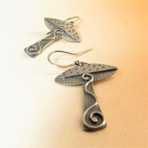 Lovely mushroom earrings in argentium sterling silver, details add up to make these a visual treat. Lightweight, comfortable, fun to wear, a great gift for nature lovers, Oxidized,  polished, 1.75 inch tall, Mushroom cap measures .75 inch wide