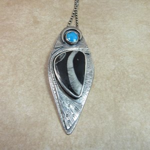 ocean inspired sterling silver pendant necklace with turquoise and fossil