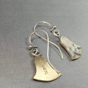 makers mark view of mixed metal bronze and sterling silver egyptian lotus earrings by Mocahete on grey background