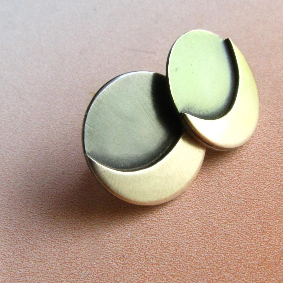 Moon stud earrings in sterling silver, one side oxidized dark, the other side bright.