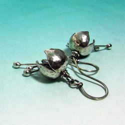 Petite, sweet with a subtle tinkle, bell earrings made from argentium silver with a lovely hammer texture that reflects light beautifully. Three stamens strike the inside of the flower  creating a soft tinkling sound.1.75 inch tall, .5 inch wide