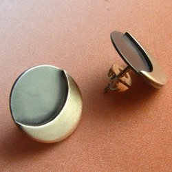 Small argentium moon stud earrings in a circle shape with bright crescent moon and shaded background for a lovely celestial earring.Push backs with sterling silver clutch backs.Perfect for everyday, our dark side of the moon pushback earrings.