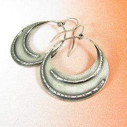 Large, lightweight argentium sterling silver dangle hoop earrings with gypsy bohemian appeal.  Surface is subtly sand textured. Simply designed for ease of wear but with a definite pow factor. Unique, lightweight earrings2 inch tall 1.5 inch wide