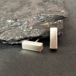 Sleek little bar stud earrings crafted in sterling silver. Chunky little bars perfect as a unisex design. Bar measures 3mm x 10mm and are completed with clutch backs to hold them securely in place. A simple, modern design perfect for all sexes.